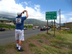 George, intrigued by a road sign